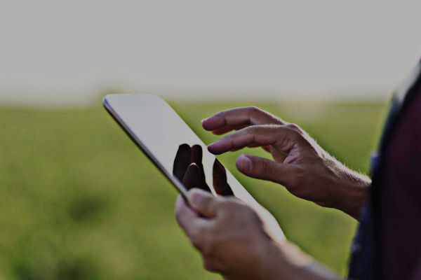 close up of a person holding a tablet