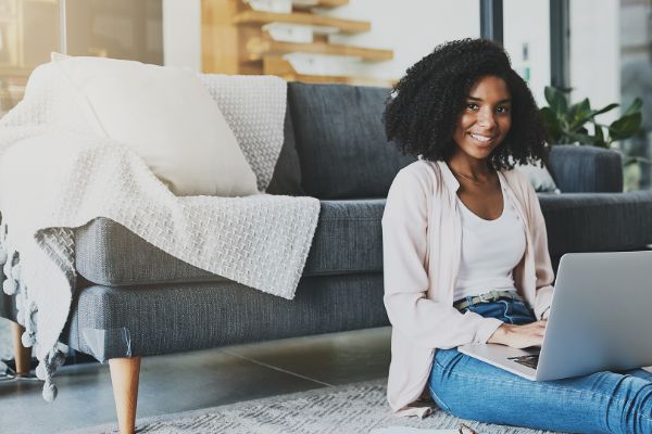 Man working from home with a laptop with headphones on